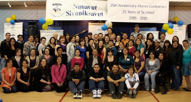 John Amagoalik surrounded by dozens of young Inuit